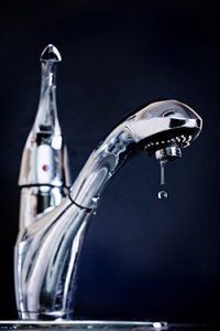 Indoor water faucet dripping water to avoid frozen pipes
