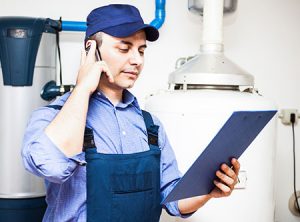 Plumber on the phone solving a problem