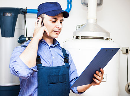 Plumber on the phone solving a problem