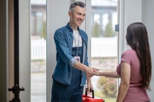 Plumber shaking hands with potential apprentice