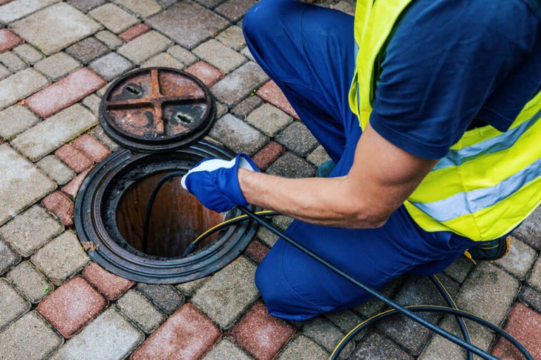 A master plumber replacing a sewer line.