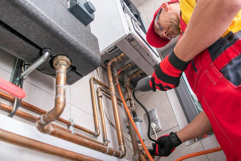 A plumber repairing gas lines